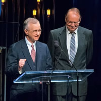
Fred Bartenstein and Gary Reid, co-authors of The Bluegrass Hall of Fame: Inductee Biographies 1991-2014, present Neil Rosenberg's Hall of Fame induction at IBMA Awards Show, World of Bluegrass, Raleigh, NC, October 2, 2014. (Photo: Daniel Boner)