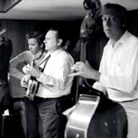Tex Logan, Fred Bartenstein, Ralph Stanley, George Shuffler at Loy Beaver's
basement, northern NJ. 1970 (photo: Artie Rose)