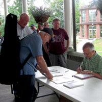 
Fred Bartenstein signs copies of The Bluegrass Hall of Fame at Augusta Heritage Centers Bluegrass Week, Elkins, WV, July, 2015. (Photo: Donald Wermuth)